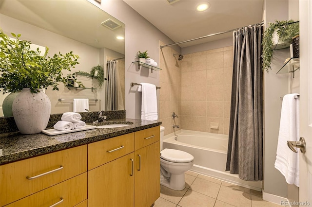 full bathroom featuring visible vents, toilet, shower / bath combo, vanity, and tile patterned flooring