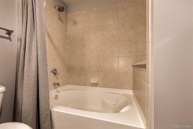 bathroom with toilet and shower / tub combo with curtain