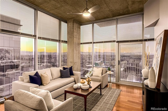 1700 Bassett St Unit 2117, Denver, CO 80202 - living area featuring a wall of windows, wood finished floors, ceiling fan, and plenty of natural light