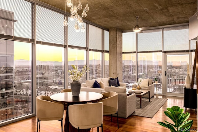 1700 Bassett St Unit 2117, Denver, CO 80202 - sunroom featuring a city view, a chandelier, and a mountain view