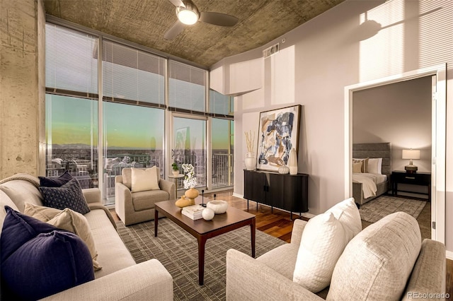 1700 Bassett St Unit 2117, Denver, CO 80202 - living area with wood finished floors, ceiling fan, and a high ceiling