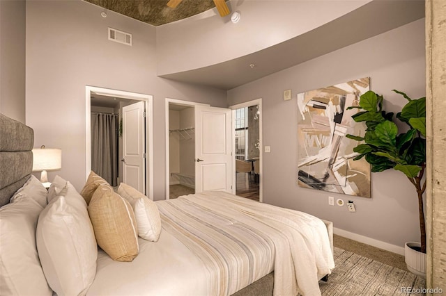 1700 Bassett St Unit 2117, Denver, CO 80202 - carpeted bedroom with baseboards and a walk in closet