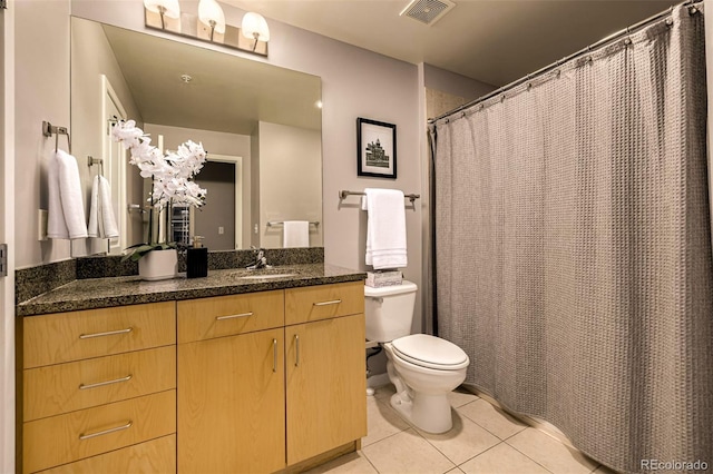 1700 Bassett St Unit 2117, Denver, CO 80202 - full bath featuring tile patterned flooring, toilet, vanity, and a shower with shower curtain