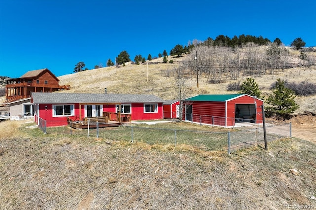 200 Silver St, Cripple Creek, CO 80813 - back of house featuring a pole building, fence, and an outdoor structure