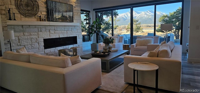 29918 Teal Run, Buena Vista, CO 81211 - living room with a mountain view, a fireplace, and wood finished floors