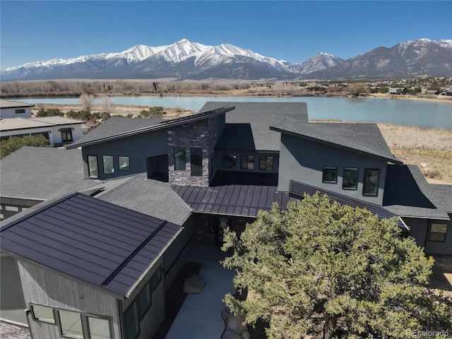 29918 Teal Run, Buena Vista, CO 81211 - rear view of property featuring a water and mountain view, a standing seam roof, and stone siding