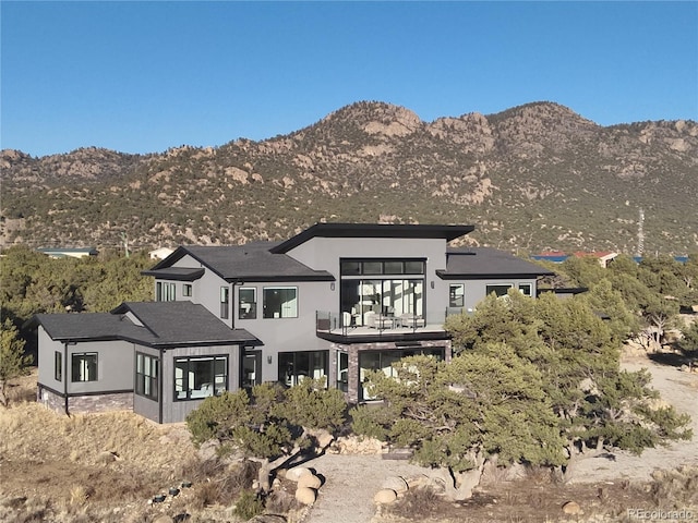 29918 Teal Run, Buena Vista, CO 81211 - back of property with a balcony, a mountain view, and stucco siding