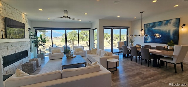 29918 Teal Run, Buena Vista, CO 81211 - living room with recessed lighting, wood finished floors, a fireplace, and a ceiling fan