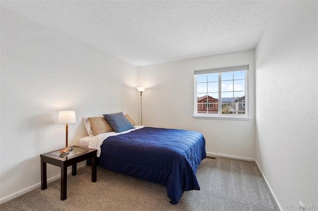 10512 Hyacinth St, Highlands Ranch, CO 80129 - bedroom featuring baseboards, carpet, and a textured ceiling