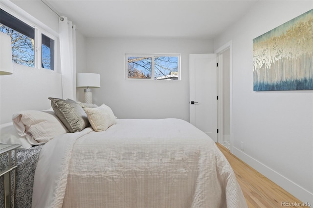 bedroom with hardwood / wood-style floors