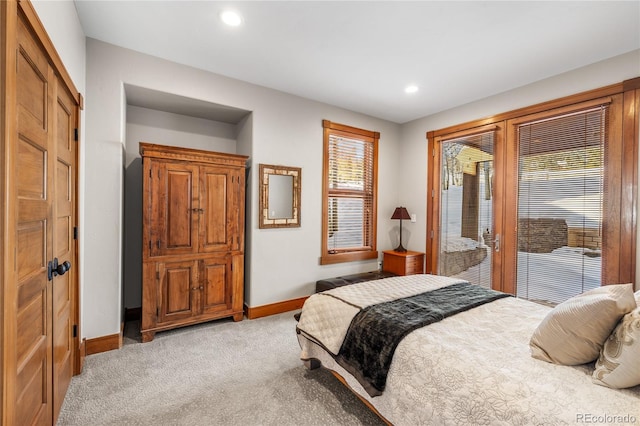 bedroom featuring recessed lighting, baseboards, and light carpet