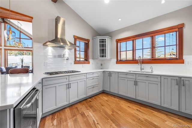 19 S Rd, Breckenridge, CO 80424 - kitchen featuring a sink, vaulted ceiling, stainless steel gas stovetop, wall chimney range hood, and gray cabinets