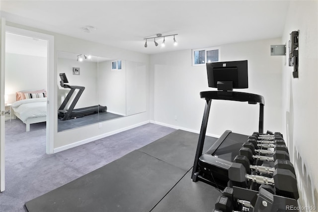 exercise area featuring dark carpet