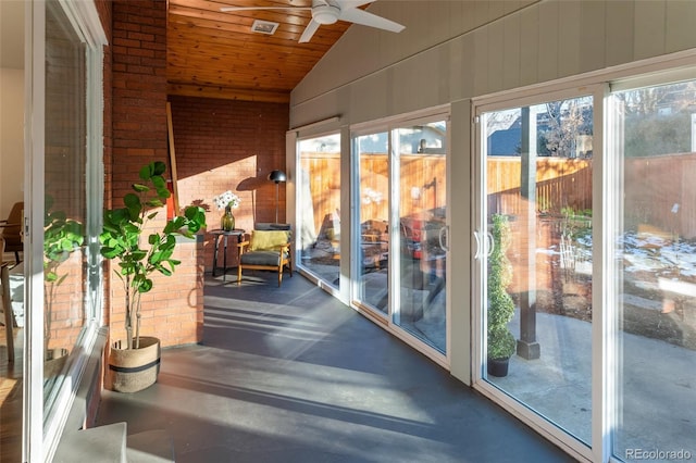 unfurnished sunroom with vaulted ceiling, wooden ceiling, and ceiling fan