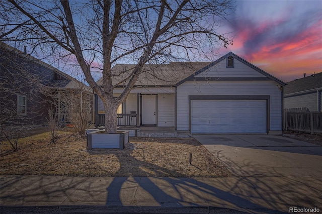 view of front of house featuring a garage, concrete driveway, covered porch, and fence