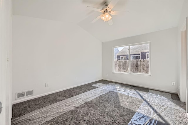 carpeted spare room featuring a ceiling fan, lofted ceiling, visible vents, and baseboards