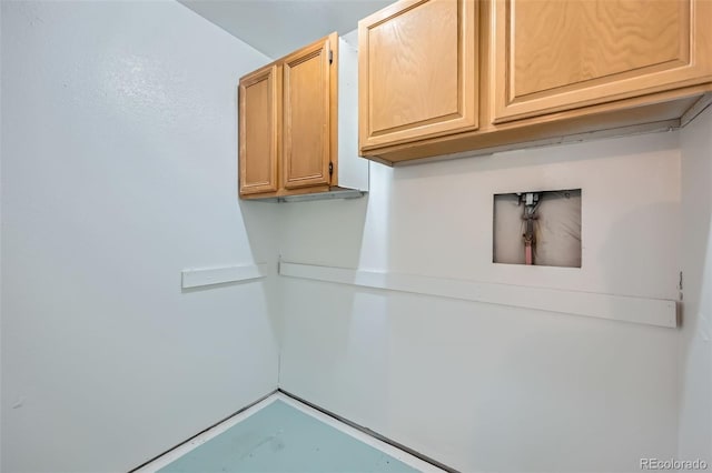 laundry room with cabinet space and washer hookup