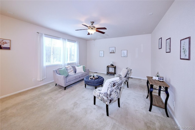 13424 W 64th Pl, Arvada, CO 80004 - living area featuring light colored carpet, a ceiling fan, and baseboards