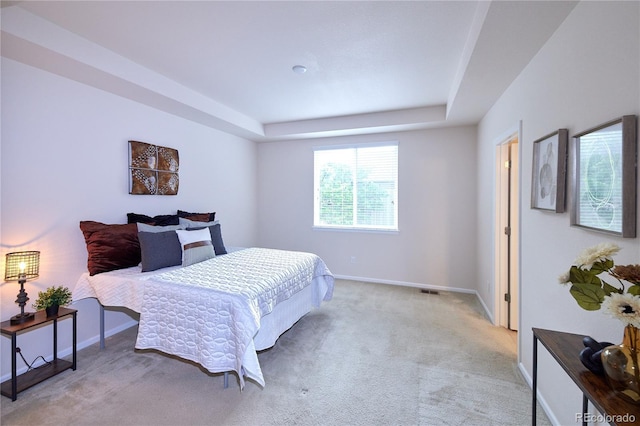 13424 W 64th Pl, Arvada, CO 80004 - bedroom featuring a raised ceiling, carpet, and baseboards
