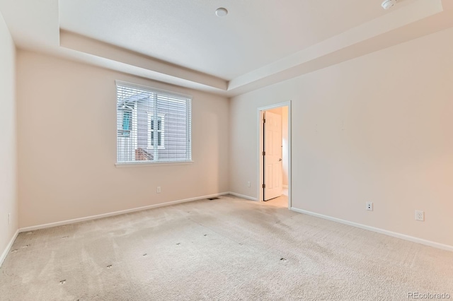 13424 W 64th Pl, Arvada, CO 80004 - unfurnished room featuring a tray ceiling, carpet flooring, and baseboards