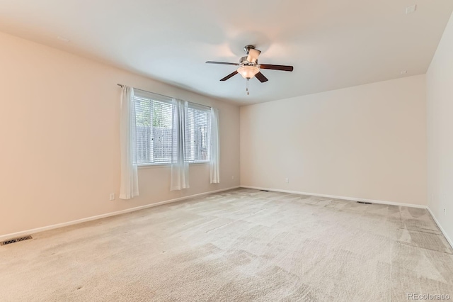 13424 W 64th Pl, Arvada, CO 80004 - spare room featuring a ceiling fan, light colored carpet, and baseboards