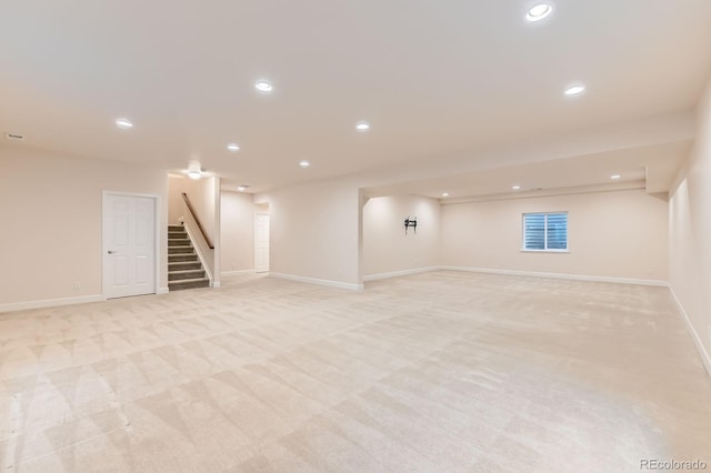 13424 W 64th Pl, Arvada, CO 80004 - finished below grade area with stairway, light colored carpet, recessed lighting, and baseboards