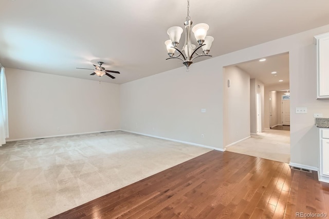 13424 W 64th Pl, Arvada, CO 80004 - spare room with ceiling fan, light wood-style floors, baseboards, a chandelier, and recessed lighting