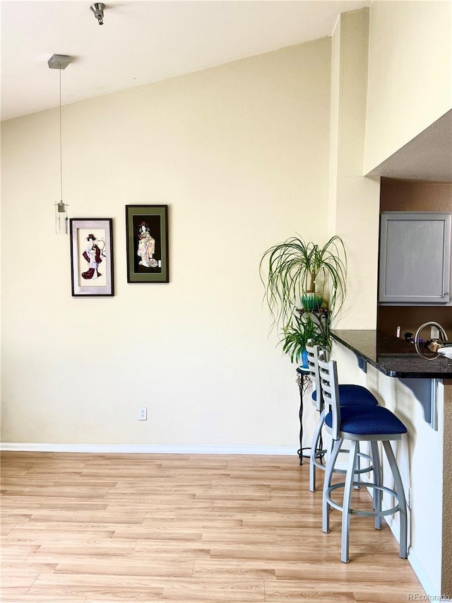 2575 S Syracuse Way Unit F301, Denver, CO 80231 - dining room featuring light wood-type flooring and baseboards