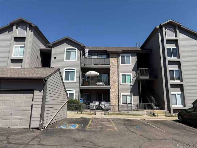 2575 S Syracuse Way Unit F301, Denver, CO 80231 - view of property featuring uncovered parking