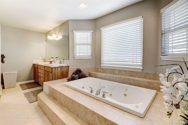 full bathroom featuring a jetted tub, tile patterned flooring, and double vanity