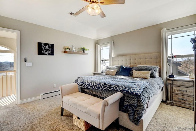 carpeted bedroom with a baseboard radiator, ceiling fan, baseboards, and lofted ceiling