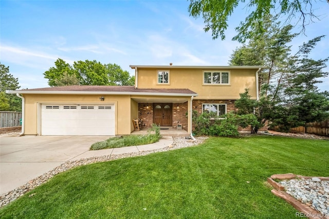 2276 S Dover Way, Lakewood, CO 80227 - traditional-style house featuring concrete driveway, stucco siding, and a garage
