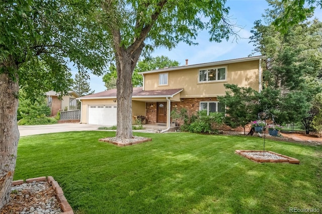 2276 S Dover Way, Lakewood, CO 80227 - traditional home with driveway, an attached garage, a front yard, and brick siding