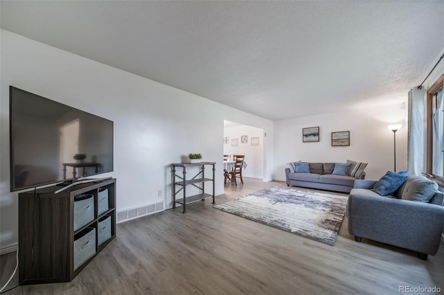 2276 S Dover Way, Lakewood, CO 80227 - living area with wood finished floors and baseboards