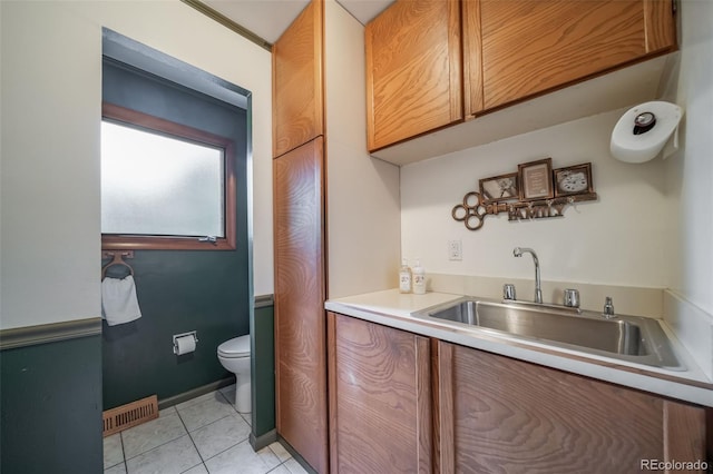 2276 S Dover Way, Lakewood, CO 80227 - bathroom with tile patterned flooring, toilet, and vanity