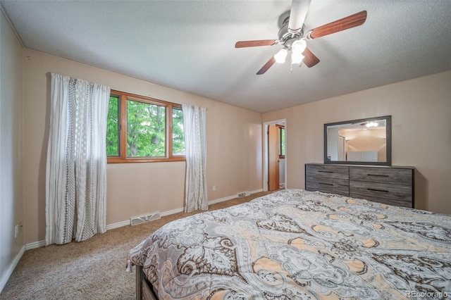 2276 S Dover Way, Lakewood, CO 80227 - carpeted bedroom with baseboards and a ceiling fan