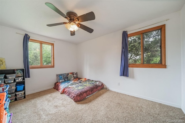 2276 S Dover Way, Lakewood, CO 80227 - carpeted bedroom featuring baseboards and a ceiling fan