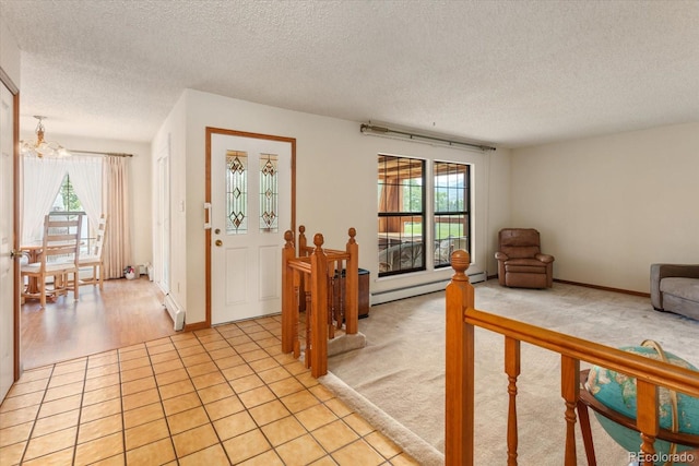 534 Crestone Ave, Salida, CO 81201 - entryway featuring a baseboard heating unit, a chandelier, and a textured ceiling