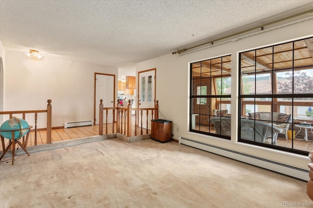 534 Crestone Ave, Salida, CO 81201 - empty room with a baseboard heating unit, carpet floors, and a textured ceiling