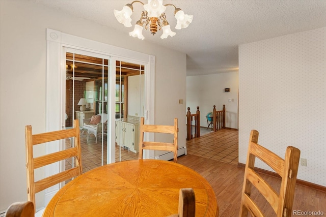 534 Crestone Ave, Salida, CO 81201 - dining area featuring a chandelier, light wood-style flooring, and a textured ceiling