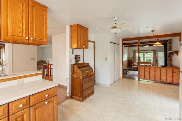 534 Crestone Ave, Salida, CO 81201 - kitchen with a ceiling fan, light countertops, brown cabinets, and pendant lighting