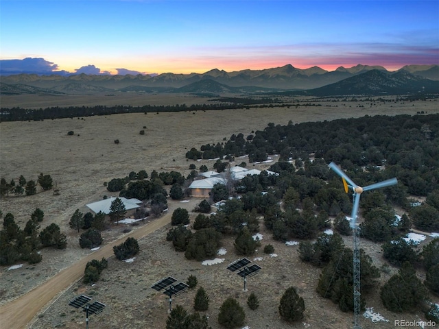 drone / aerial view featuring a mountain view and a rural view