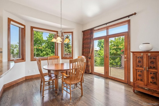 16442 Rocky Point Ln, Morrison, CO 80465 - dining area with a chandelier and wood finished floors