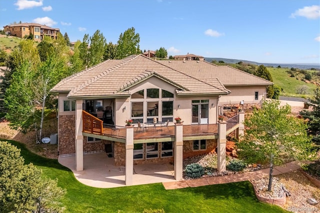 16442 Rocky Point Ln, Morrison, CO 80465 - rear view of property with a patio area, stucco siding, stone siding, and a lawn