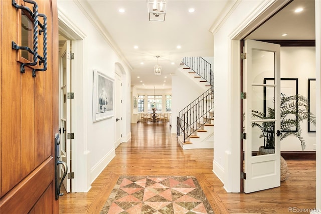 958 S Columbine St, Denver, CO 80209 - foyer with stairs, baseboards, light wood-style flooring, crown molding, and recessed lighting
