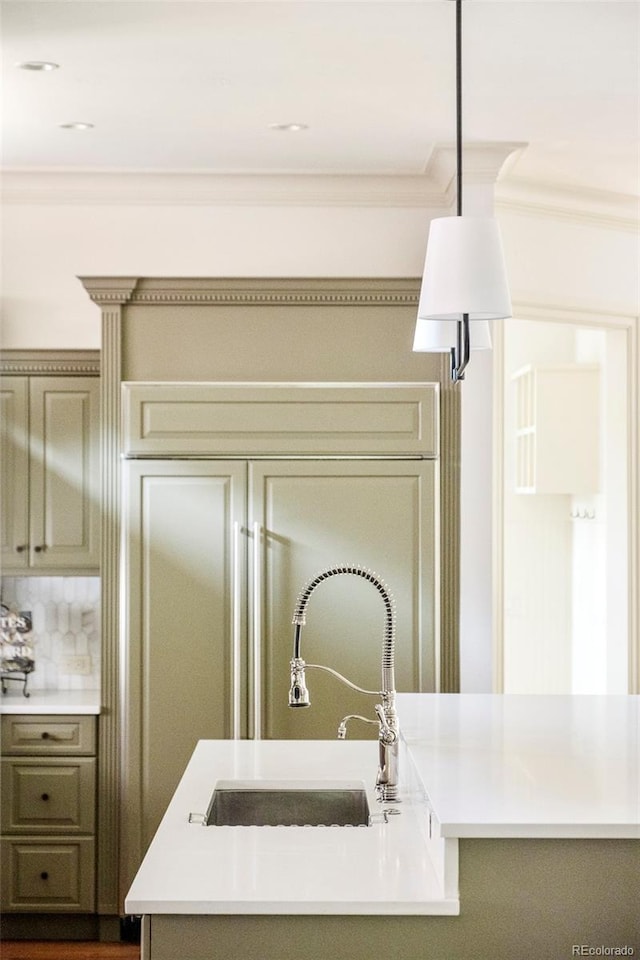 958 S Columbine St, Denver, CO 80209 - kitchen featuring a sink, light countertops, and crown molding