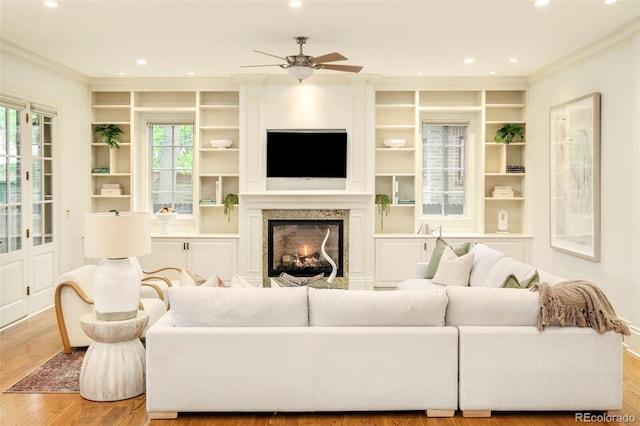 958 S Columbine St, Denver, CO 80209 - living area featuring crown molding, wood finished floors, recessed lighting, ceiling fan, and built in shelves