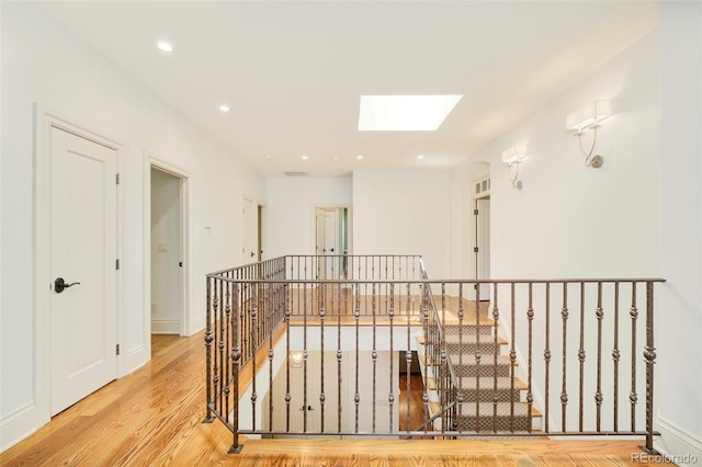 958 S Columbine St, Denver, CO 80209 - corridor featuring a skylight, wood finished floors, an upstairs landing, and recessed lighting