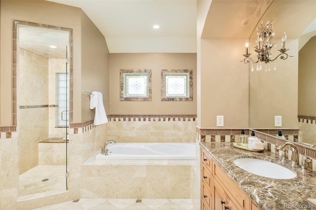 958 S Columbine St, Denver, CO 80209 - full bathroom featuring a garden tub, a shower stall, vanity, and a chandelier