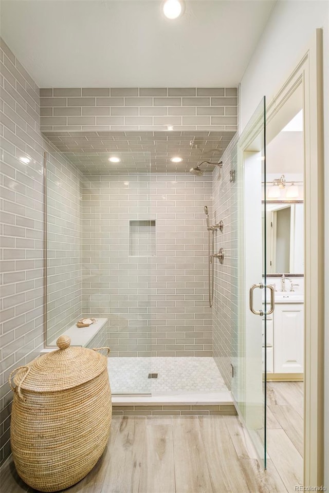 958 S Columbine St, Denver, CO 80209 - bathroom featuring wood finished floors, a shower stall, recessed lighting, and vanity